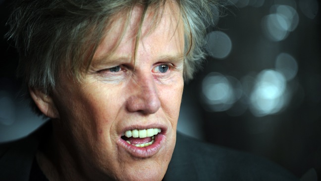 Actor Gary Busey arrives at the premiere